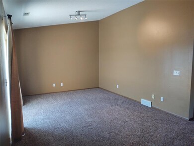 living room with vaulted ceiling