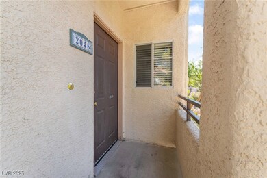 Property entrance featuring stucco siding