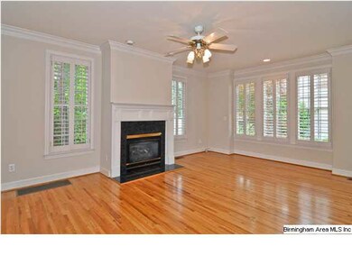 The living room features a fireplace with gas logs