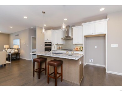 Kitchen with 42 Inch Cabinets and Hardwood Floorin