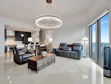 ANOTHER VIEW OF LIVING AREA SHOWING OPEN TO KITCHE