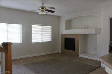 Unfurnished living room with a tiled fireplace, a