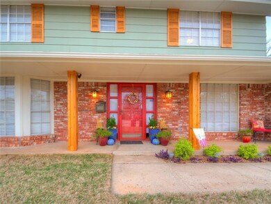 Charming covered front porch with cedar beams.