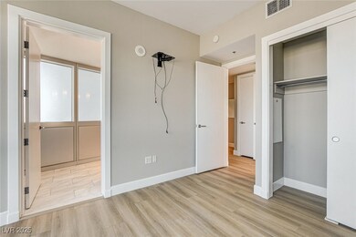Unfurnished bedroom featuring baseboards, a closet
