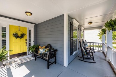 Lots of curb appeal with yellow front door and sid
