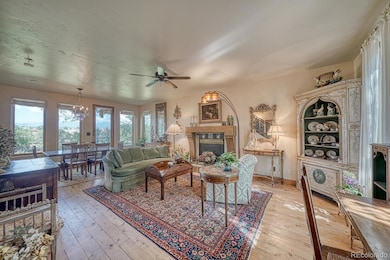 After entering, the living area is to the right with rustic hardwood floors.
