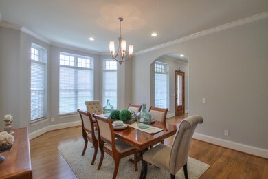 Large formal dining room off the foyer with convenient access to the kitchen and ample natural light from bay window.