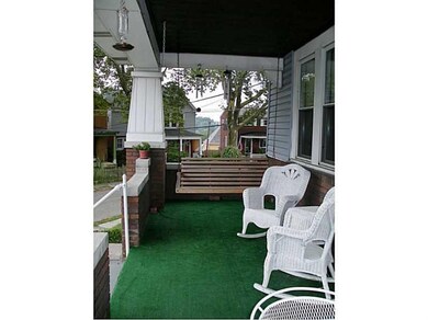 Patio/Deck. Spacious front porch with relaxing swi