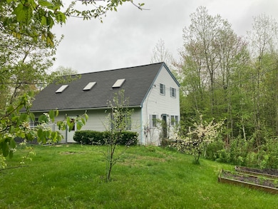 Front approach w/fruit trees blooming.