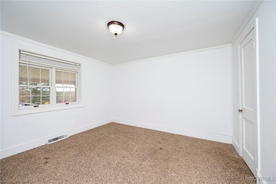 Spare room with carpet floors