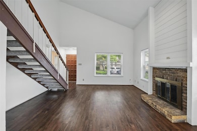 Unfurnished living room with vinyl finished floors