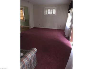 Living room has lots of natural light, clean plush