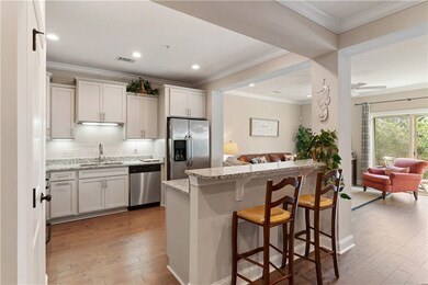 Kitchen and bar/island as viewed from front entry