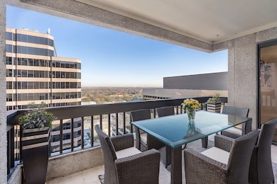 One of two balconies in the home over looking treetop views of Preston Hollow.
