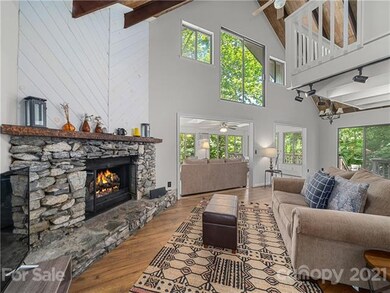 Greatroom with vaulted ceilling and exposed wood b
