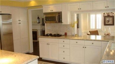 Spacious kitchen with granite counters, stainless 