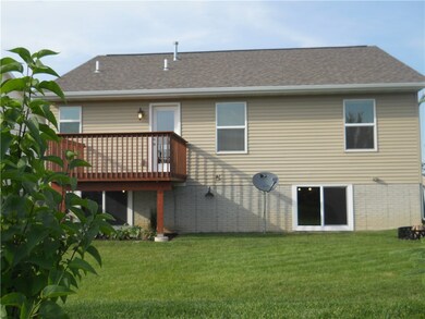 The deep rear yard with many plantings provides th