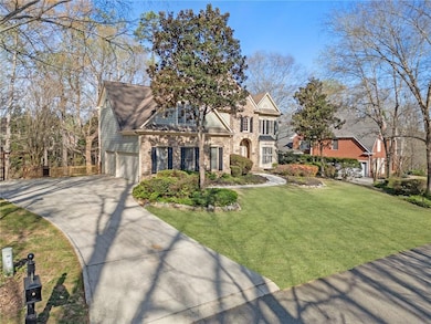 View of front facade featuring a front yard, an at