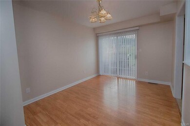 Dining room with laminate floors and sliding door 
