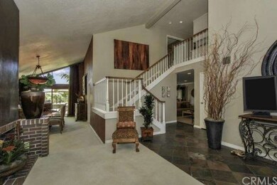 Spacious formal entry with high ceilings and firep