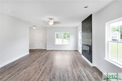 Spacious Family Room with Electric Fireplace.