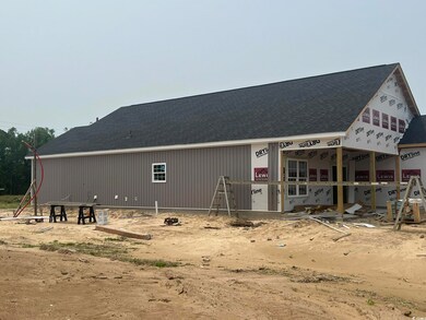 Rear view of house with a shingled roof