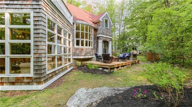 Backyard surrounded by private woods