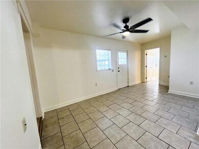 2nd photo of the living room which is open to the kitchen