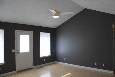 new paint and floors in the living room space is much larger than the picture shows