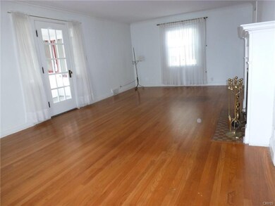 Living room with door to enclosed porch