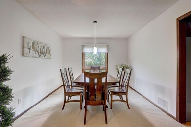 Spacious formal dining with plenty of space for a large table and a lovely backyard view.