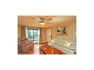 Living room leads to private balcony