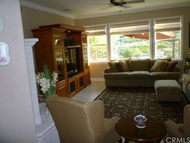 Family room overlooking landscaped backyard and re
