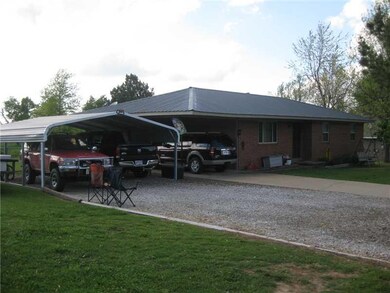 Exterior Front. This view shows added covered parking - accommodates three vehicles