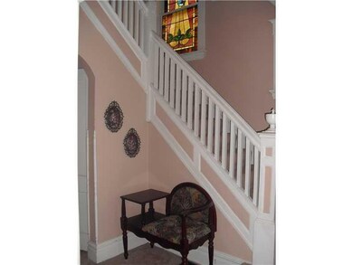 Entry/Foyer. Stained glass windows accent the entr