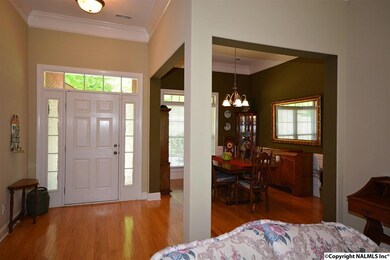 Features 10' ceiling w/crown molding and hardwood floors.