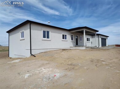 Stucco sided rancher. Placement allowing for a walkout basement.