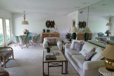 Living Room Looking Out To Rear Yard & Covered Pat