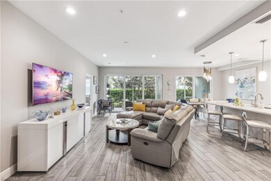 Living room with light hardwood / wood-style floor