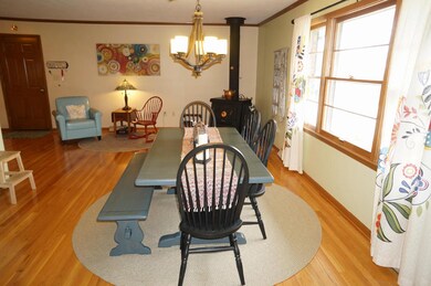 Dining Room with Gas Stove & wood floors