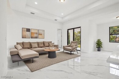 Living room featuring marble finish floor, a tray