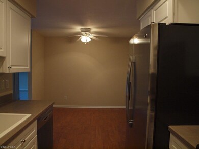 Eating area with wood laminate flooring
