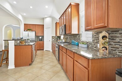 Experience the joy of cooking in this fully-equipped kitchen with stainless steel appliances, including a 4 burner gas cooktop.