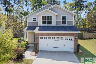 Be greeted by a grassy front yard with mature land