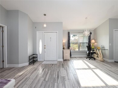 Foyer entrance with light hardwood / wood-style fl