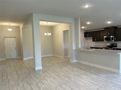 Living Room/Kitchen/Dining Area