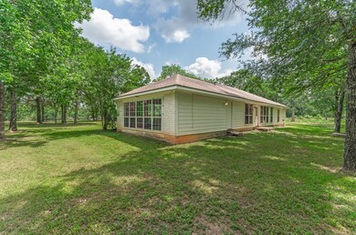 This photo shows a charming single-story home with