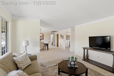 Living room featuring carpet and wallpapered walls