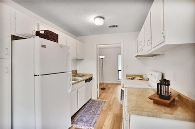 View of the light bright kitchen from the sliding 