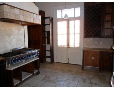 Kitchen. Beautiful tile flooring and backsplash.